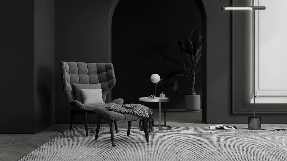 Dark reading corner in front of an arched door