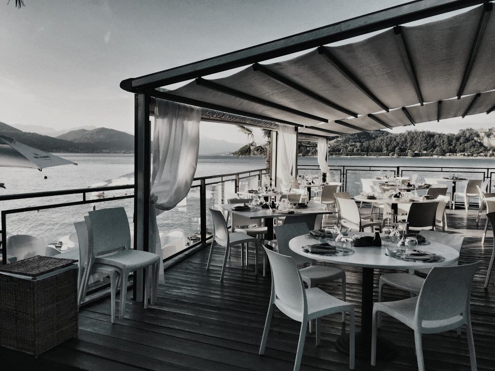 Restaurant terrace with awnings overlooking the sea