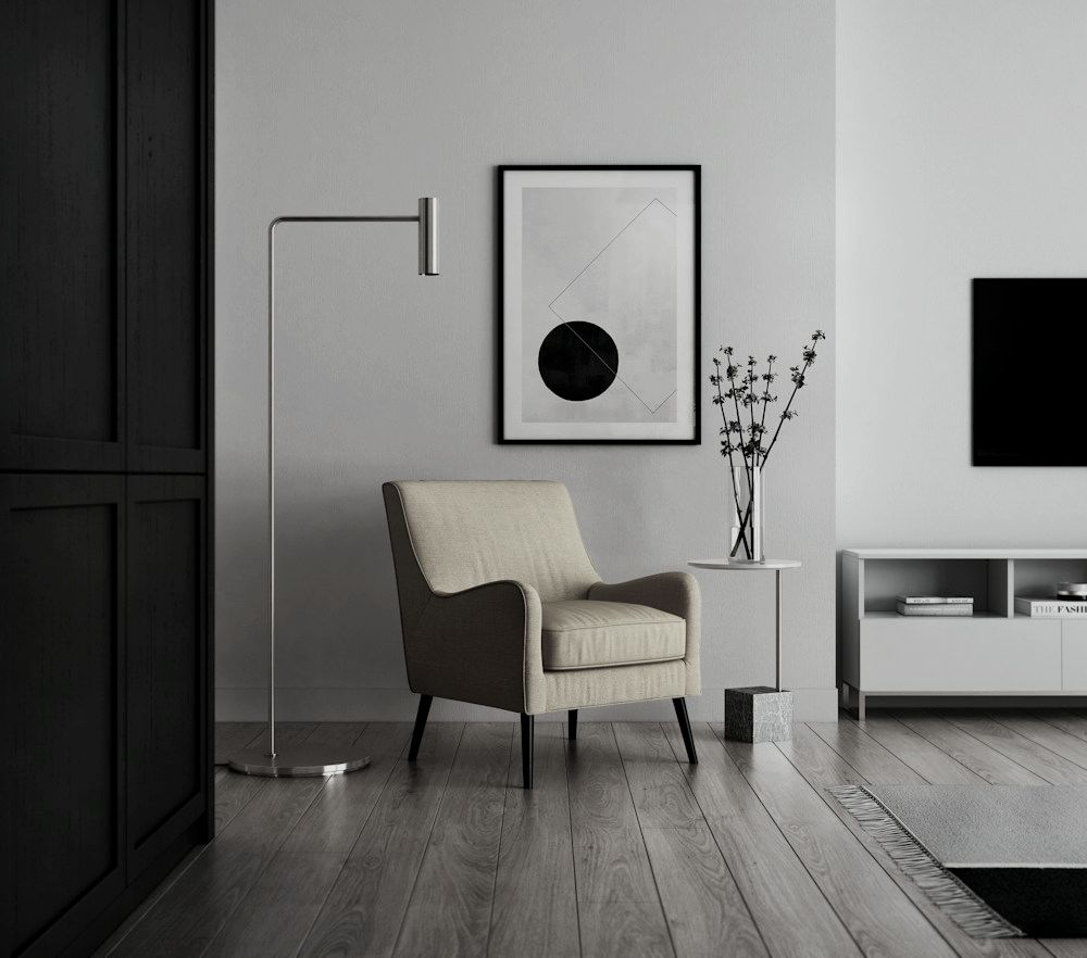 Seating corner with a dark door, armchair and floor lamp
